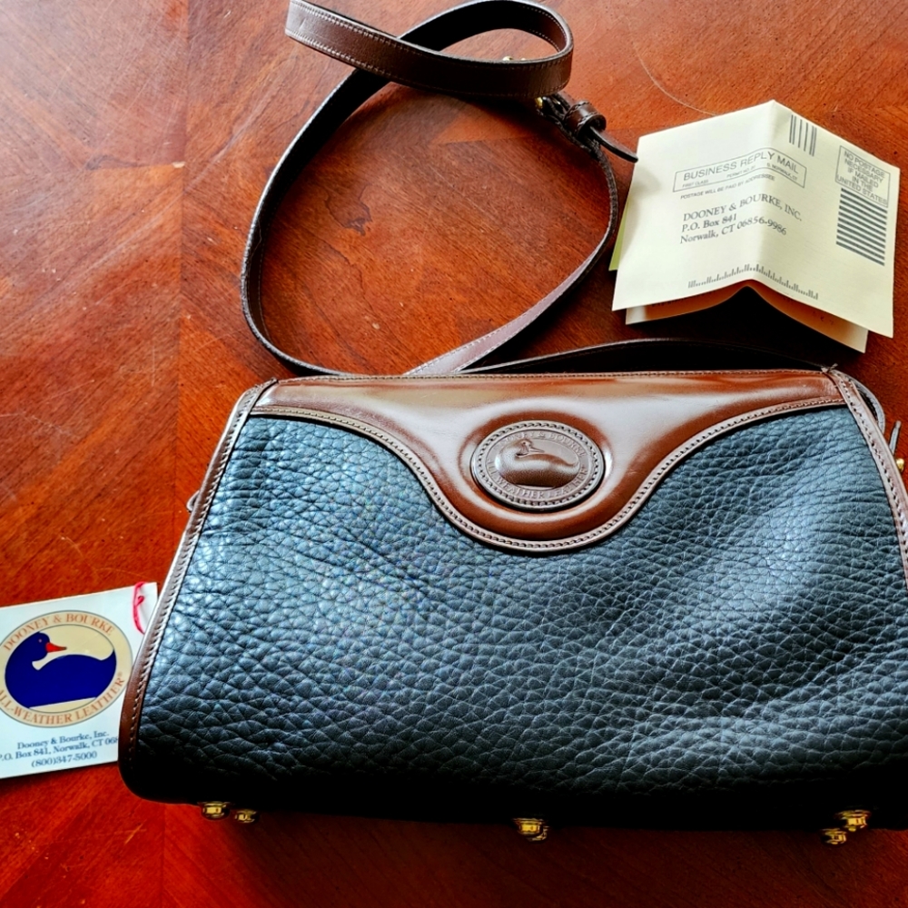 New never used tags attached Dooney Bourke brown and black crossover leather bag